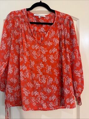 Gorgeous flowy red and floral blouse. 100% polyester